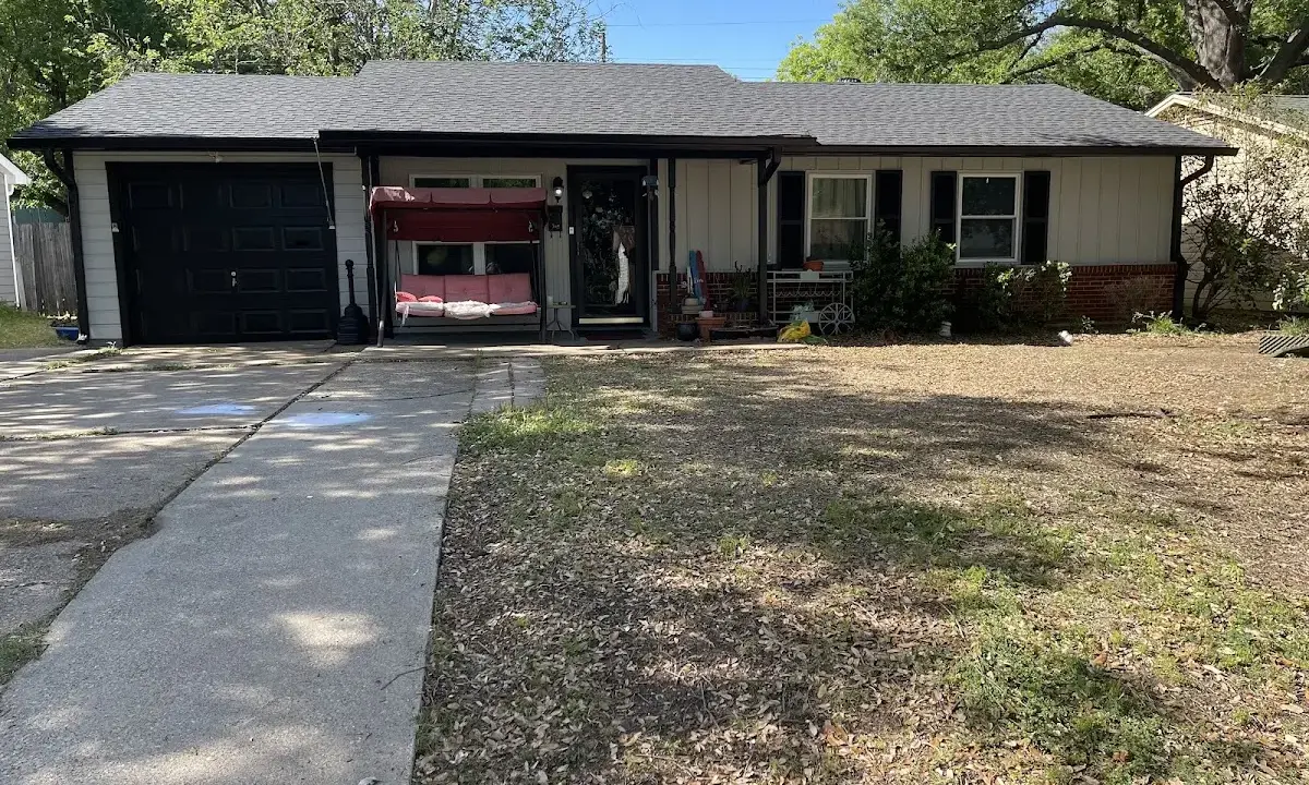 Asphalt Shingle Roof Repair crew at work on a residential roof in Burnet